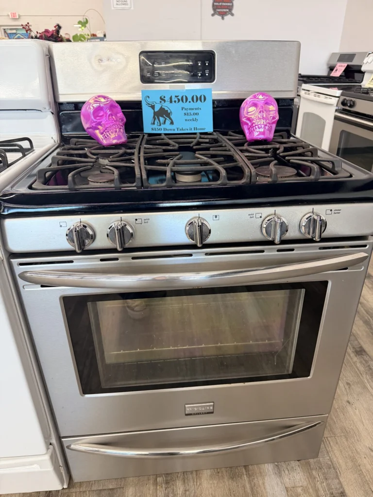 Stainless gas range with Halloween skull price tags at DT’s Outlet in Wichita