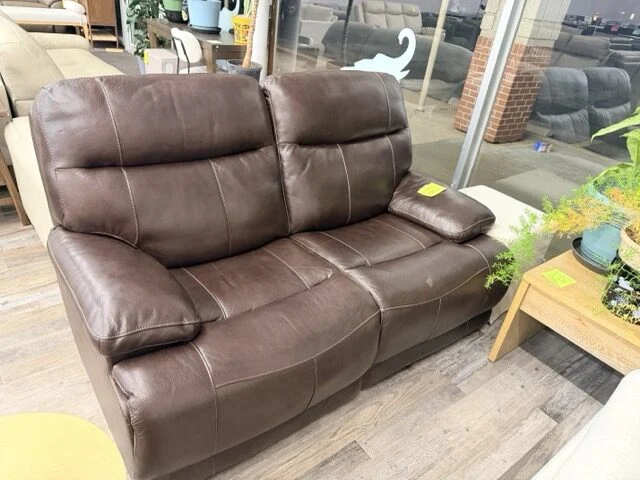 Brown leather reclining loveseat at DT's Outlet in Wichita