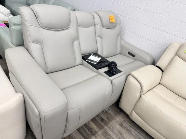 Light gray power reclining loveseat with center console and cupholders at DT's Outlet