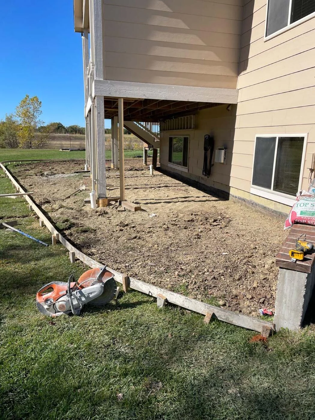 Forms set for a curved backyard concrete patio