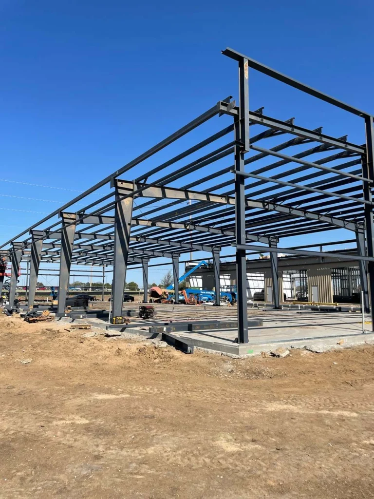 Red-iron frame for a multi-bay commercial metal building